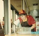 Mary Moreland gives out one of the last orders at Pup 'N' Taco - 1980s